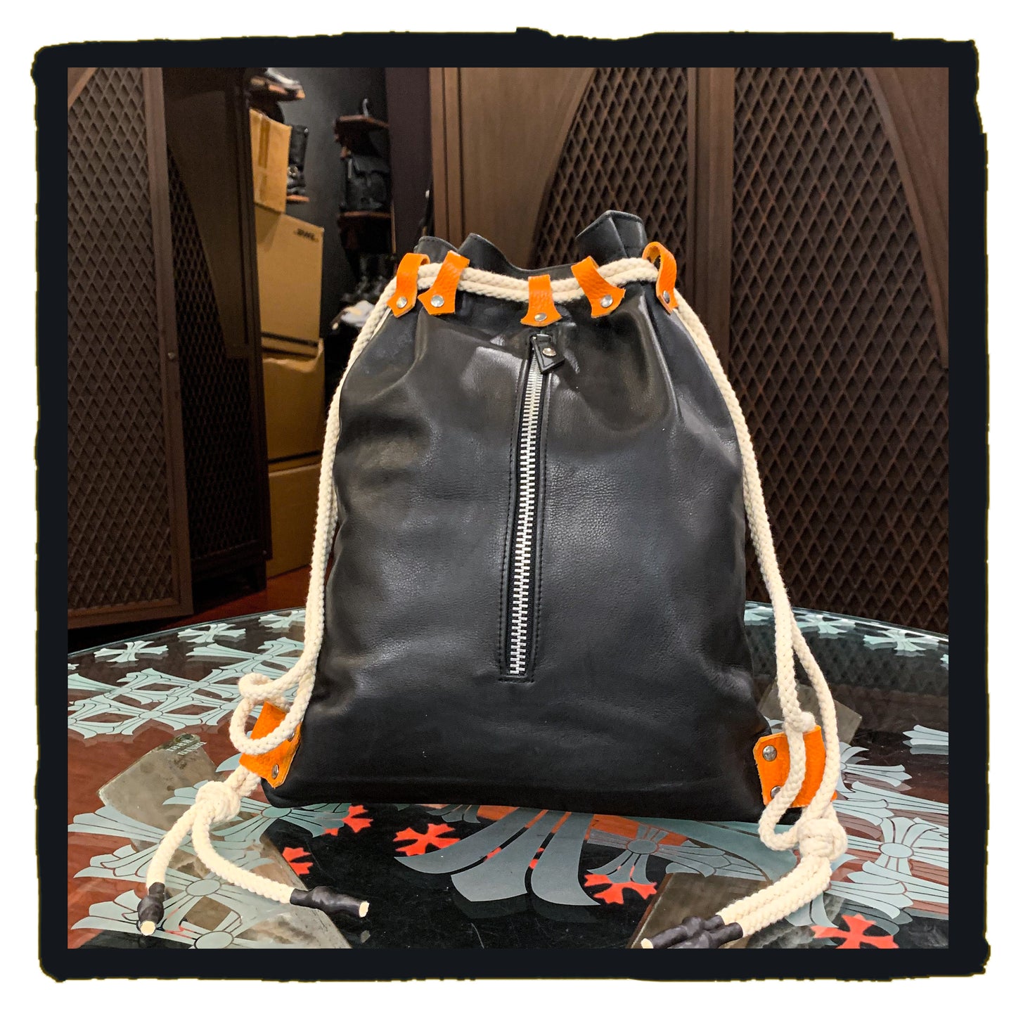 20-bp003a leather sport backpack with suede fleur de lys patch