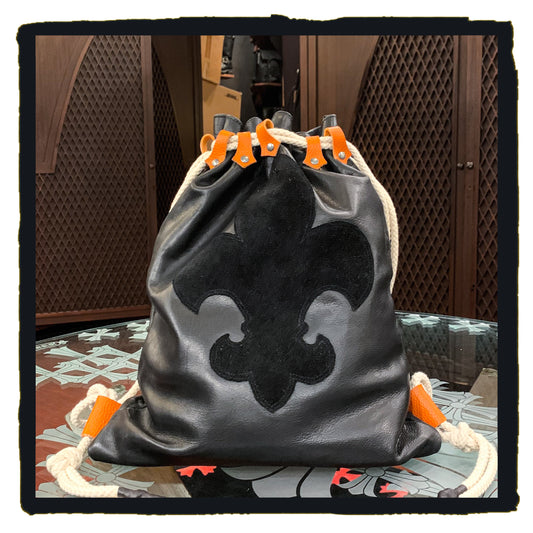 20-bp003a leather sport backpack with suede fleur de lys patch